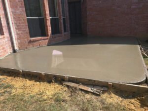 Wet concrete patio waiting to be dried.